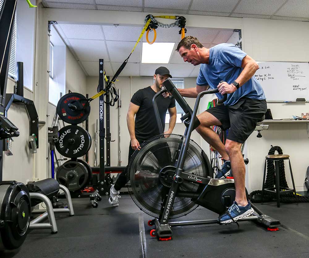 Picture of Greg and client training with a bicycle